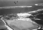 A 5-5-34 aerial view looking south at the 'Gymkhana Hop' stunt team of VN-508's F2B-1s perform...jpg
