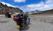 Cub-125-with-camping-luggage-at-the-top-of-the-Col-de-l'Iseran.jpg