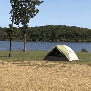 Tent by the lake on grass