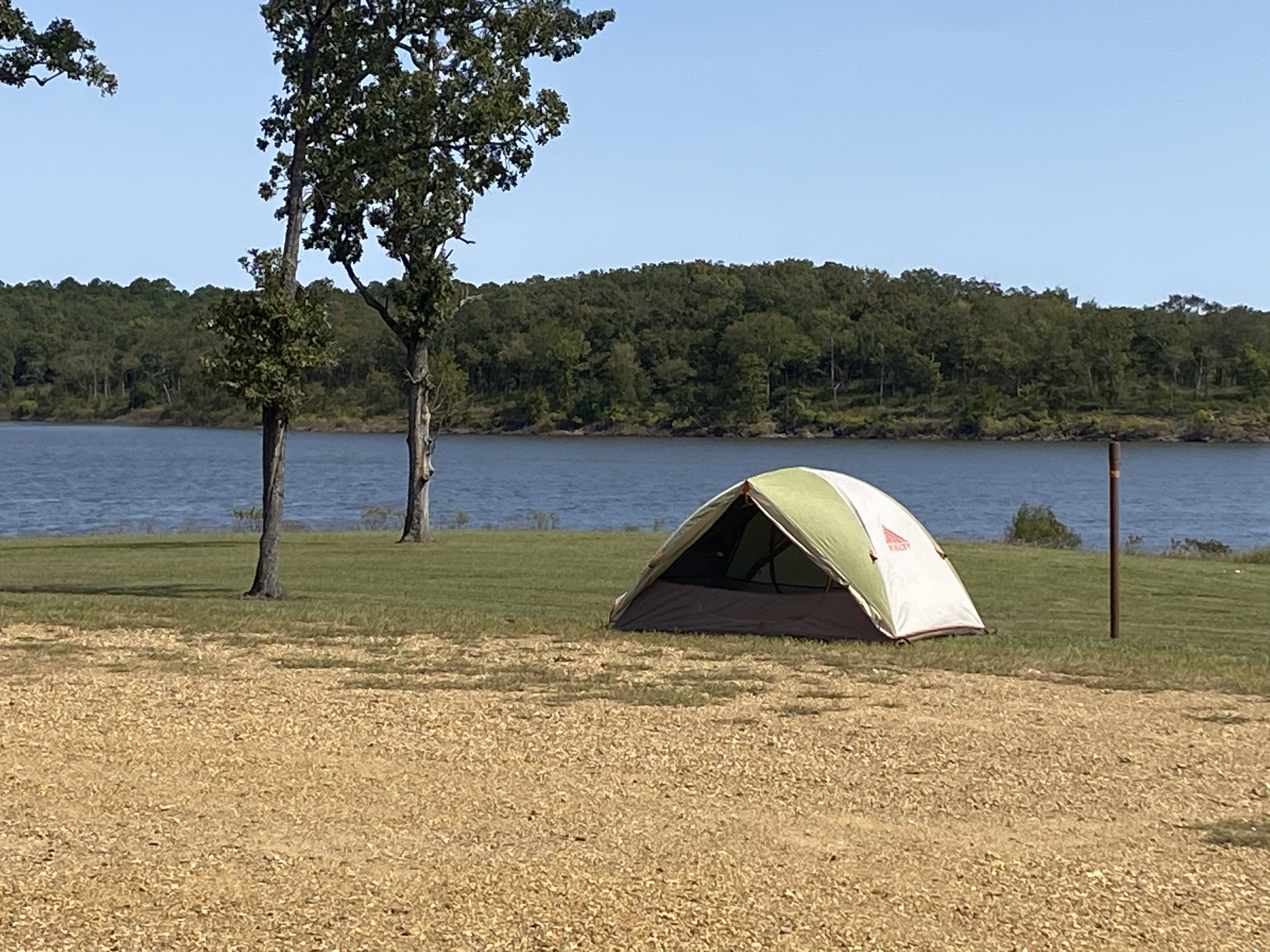 Tent by the lake on grass